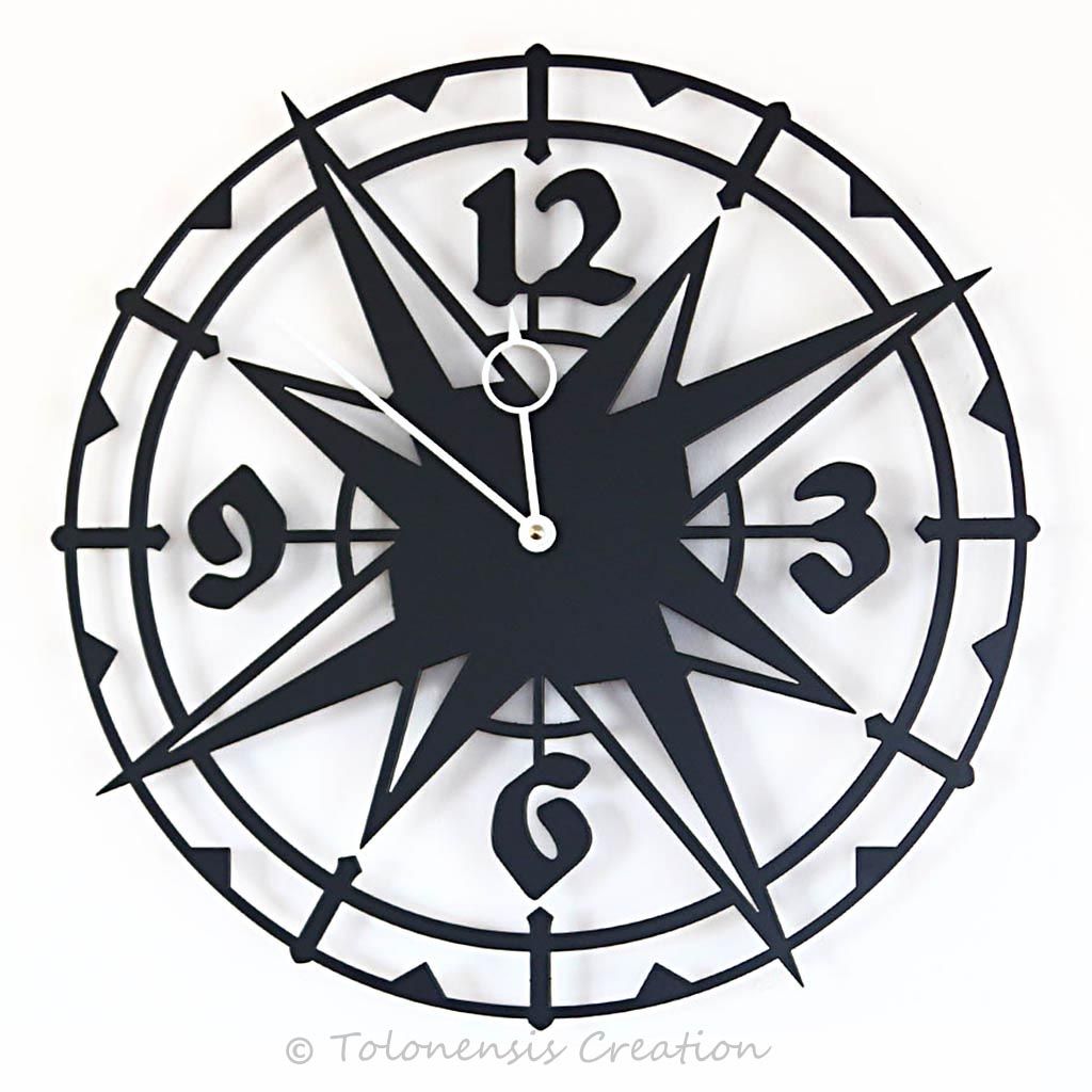 The exotic wall clock Colombus with a diameter of 40 cm. Steel laser cut. Made in EU